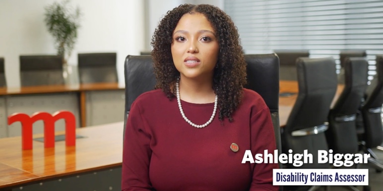 An image of Disability Claims Assessor Ashleigh Biggar, in conversation about income disability benefits.