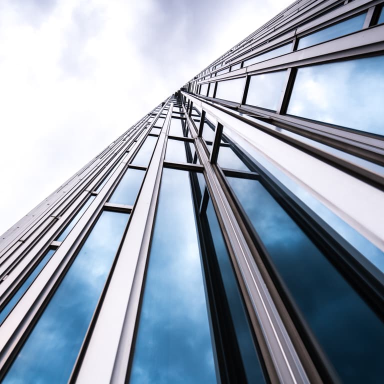 A high-rise building made of glass.