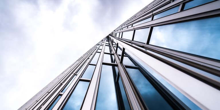 A high-rise building made of glass.