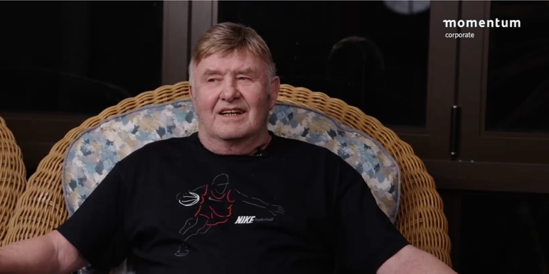 A Momentum Corporate branded image showing Leon Schuster in conversation for the Coffee Conversations webcast.