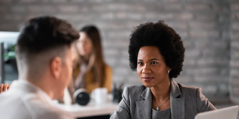 A lady speaks to her Momentum financial adviser to find out more about the Section 14 transfer that will move her pension from one fund to another.